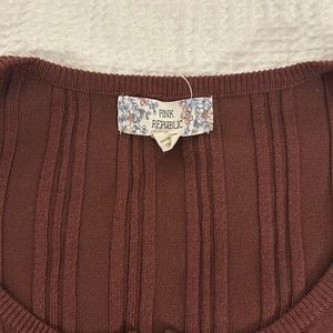 Pink republic top. Size small. Zipper front.Like new condition.